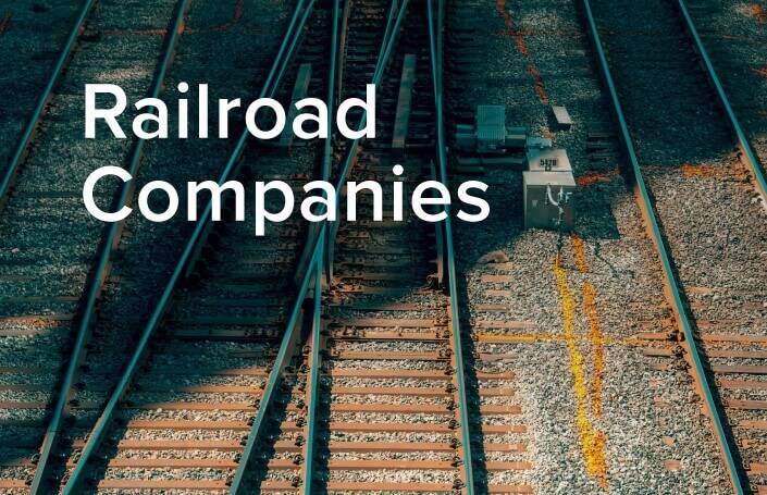 Railroad companies text with railroads in the background.