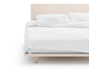 A minimalistic bed in a bright room symbolizes CLC Lodging's corporate lodging management solutions, tools and insights to control lodging costs.